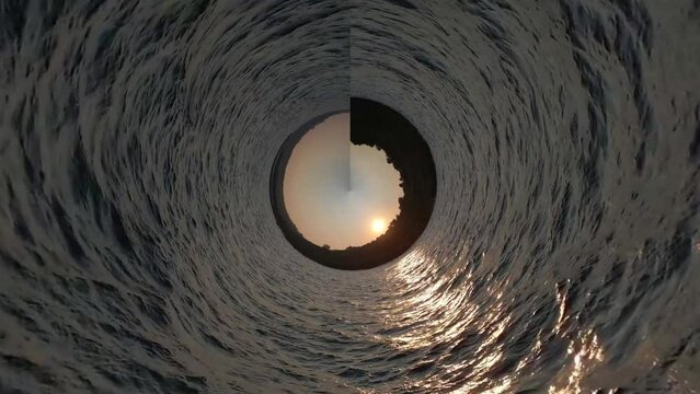 360 degrees of Equirectangular to Stereographic Panorama.
Ocean water fast moving. Beautiful view of sunset in rocky hills on the sea. Spherical projection. Loop rotate.