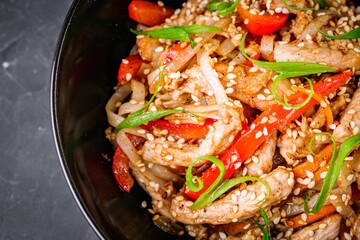 delicious chinese fried noodles on a black background