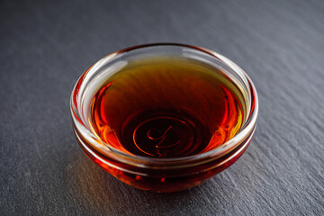 fragrant fish sauce on a black stone background