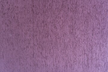 Fototapeta premium Close-up of the purple textile texture, background and wallpaper.