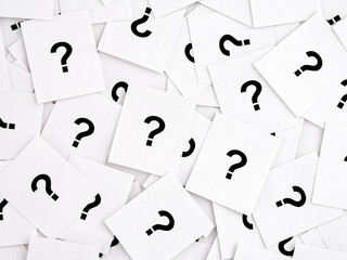 A lot of paper notes with question marks.