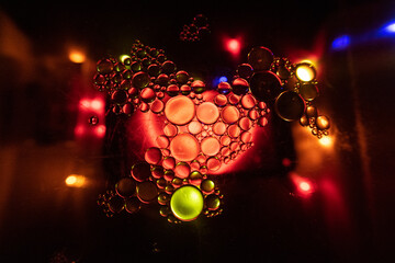 Abstract colourful macro bubbles in oily water