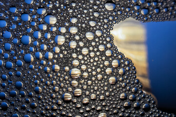 Abstract colourful macro bubbles in oily water