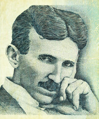 Portrait of Nikola Tesla, famous serbian scientist, engraving on old banknote of the bank of Serbia - obrazy, fototapety, plakaty