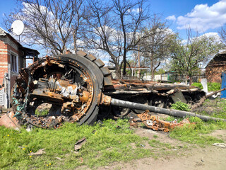 Fototapeta na wymiar The wreckage of a burnt Russian tank in the war with Ukraine. War in Ukraine