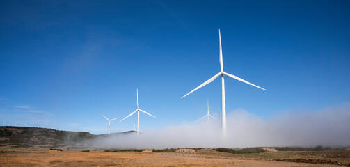 wind turbines above the clouds