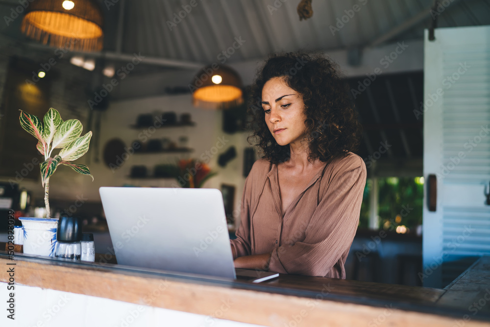 Aufkleber millennial female blogger using laptop application for communicate with web followers in social medi