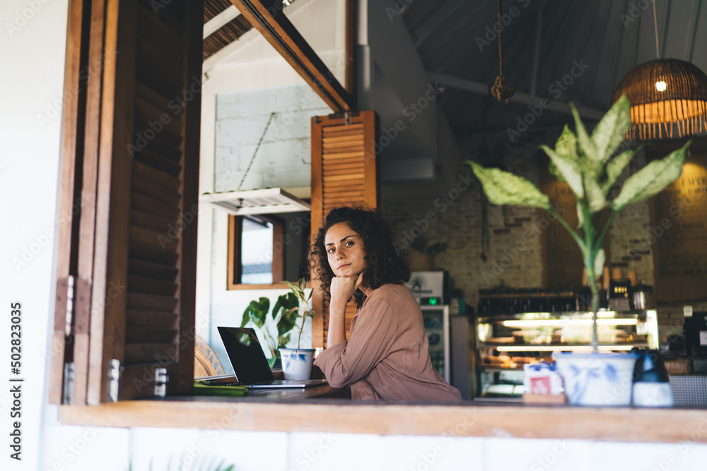 Aufkleber portrait of skilled female programmer with modern laptop computer looking at camera during remote wo