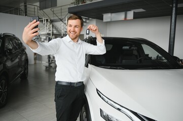 Man buying a car at a showroom