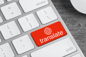 Red button with word TRANSLATE on computer keyboard, closeup view