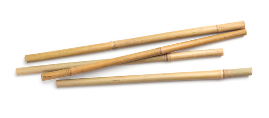 Dry bamboo sticks on white background, top view