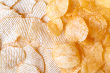 Potato chips exture background top view. Crispy snack, junk food, fastfood, flatlay