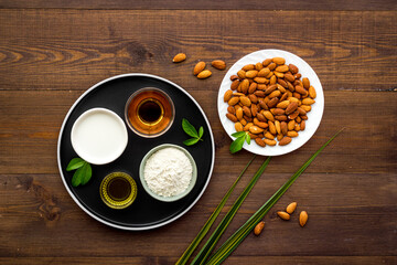 Sweet almond oil and milk with nuts seeds. Healthy food and cosmetic background