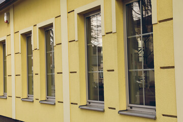 Fototapeta na wymiar Closeup view of building with stylish grey windows