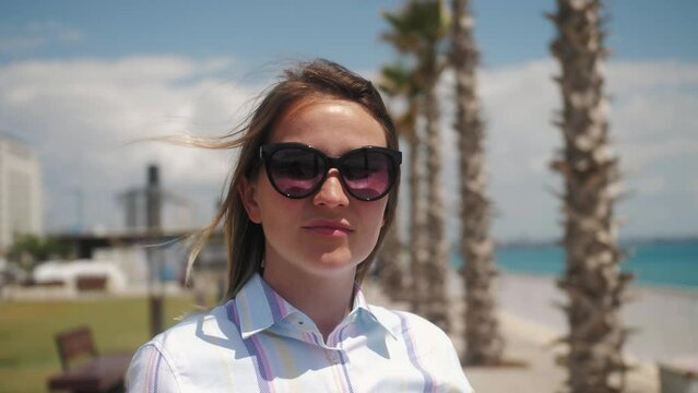 Close up portrait of woman wearing sunglasses. Summer portrait.