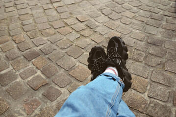 Woman in comfortable shoes and jeans outdoors, closeup