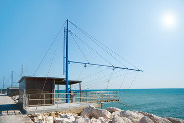 Fototapeta Shore operated stationary lift net on coast obraz
