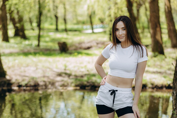 Portrait of a girl resting after outdoor workout. Take a break after yoga or stretching