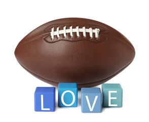 American football ball and cubes with word Love on white background