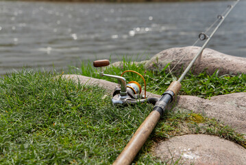Fishing rod near the river ready for fishing