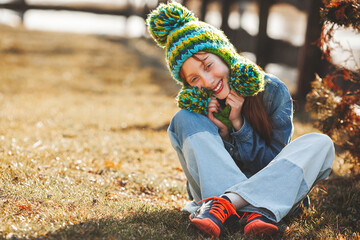 Funny redhaired girl. Red haird teenager. Cheerful girl on fall background.