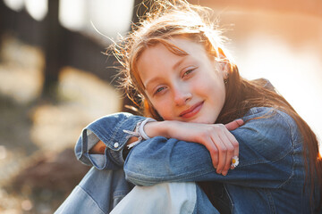 Cute red haired girl portrait. Pretty teen outdoors. Redhaired teenager.