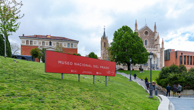 Madrid, Spain - April 23, 2022: A Picture Of The Museo Nacional Del Prado Sign, And The Church Of Saint Jerome The Royal In The Distance.