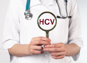 HCV test analysis. Magnifying glass in doctors hand. High quality photo