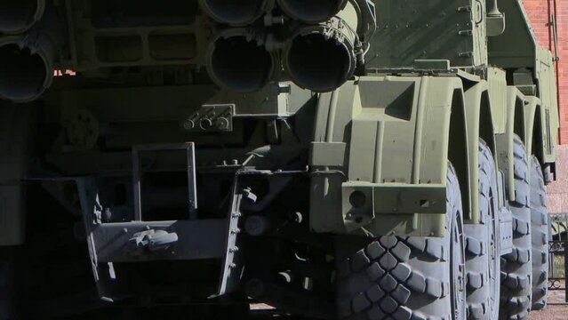 multi-barreled multiple launch rocket launcher in a combat position panorama rear view