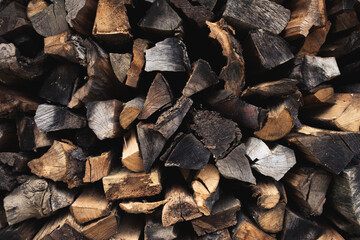 pattern of firewood for the firebox, background of chopped logs