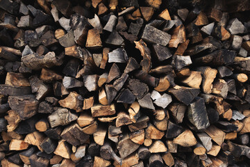 pattern of firewood for the firebox, background of chopped logs