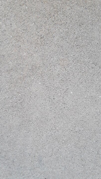 Cement Background with Speckles of White Paint