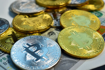 Silver and golden cryptocurrency bitcoin coins.