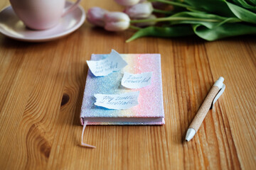 Affirmation, inspirational quotes concept. Paper with motivation affirmation message and...