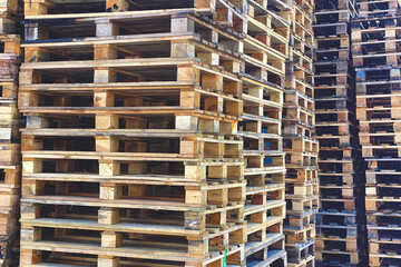 Big bunch of used wooden cargo pallets