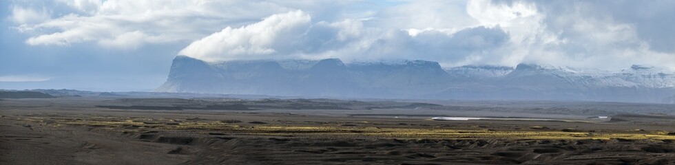 Iceland autumn tundra landscape near Haoldukvisl glacier, Iceland. Glacier tongue slides from the...