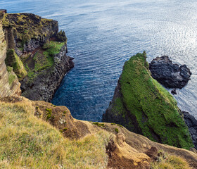 View during auto trip in West Iceland highlands, Snaefellsnes peninsula, Snaefellsjokull National Park, Londrangar View Point. Spectacular black volcanic rocky ocean coast.