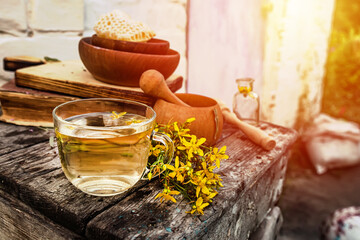 St. John's wort. Hypericum plants yellow flower medicinal tea from dry herbs or a drink from tincture of medicinal plants crushed in a mortar. 