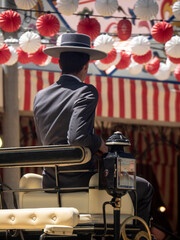 Conductor de coche de caballos en la feria de Abril / Horse car driver at the April fair. Sevilla