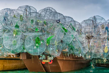 Gordijnen A multitude of lobster cages on Arabian dhows at Abu Dhabi's fishing port Al Mina  © Christian Schmidt 