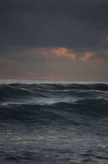Naklejka na ściany i meble waves in the ocean at sunset