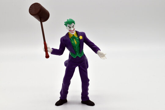 Bologna - Italy - April 19, 2022: The Joker miniature isolated on white background. Joker from DC comics.
