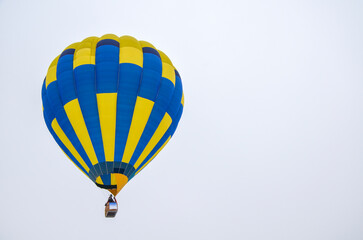 Fototapeta premium Colorful multi colored hot air balloons soaring with sky background during aeronautic festival
