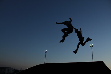 silhouette of a child jumping