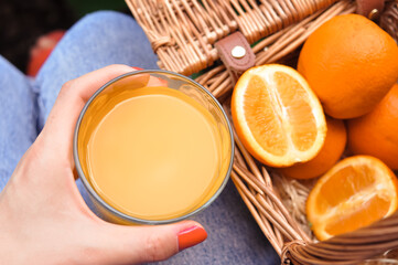 hand holding orange juice 