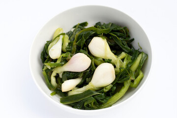 Pickled spring onion in white bowl