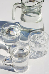 Glasses with water on white backgound.