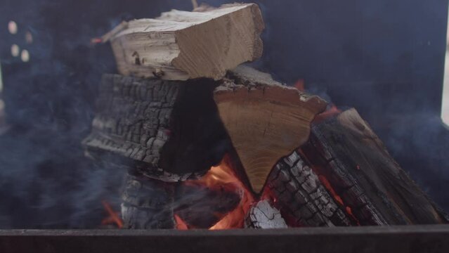 Firewood on fire. The biggest drawback and major environmental impact of wood burning is wood-smoke pollution. Sustainability of heating with wood.