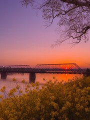 Sunset with bridge and river.