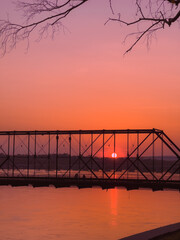 Fototapeta na wymiar Sunset with bridge and river.